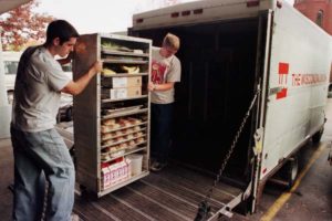 Wisconsin Union Food Service student staff loading trucks to transport food.